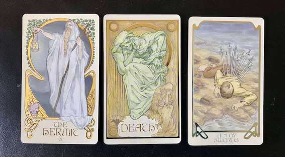 Tarot cards: Hermit, Death, 10 of Swords