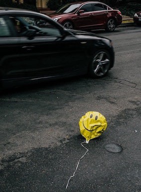 Deflated balloon on street